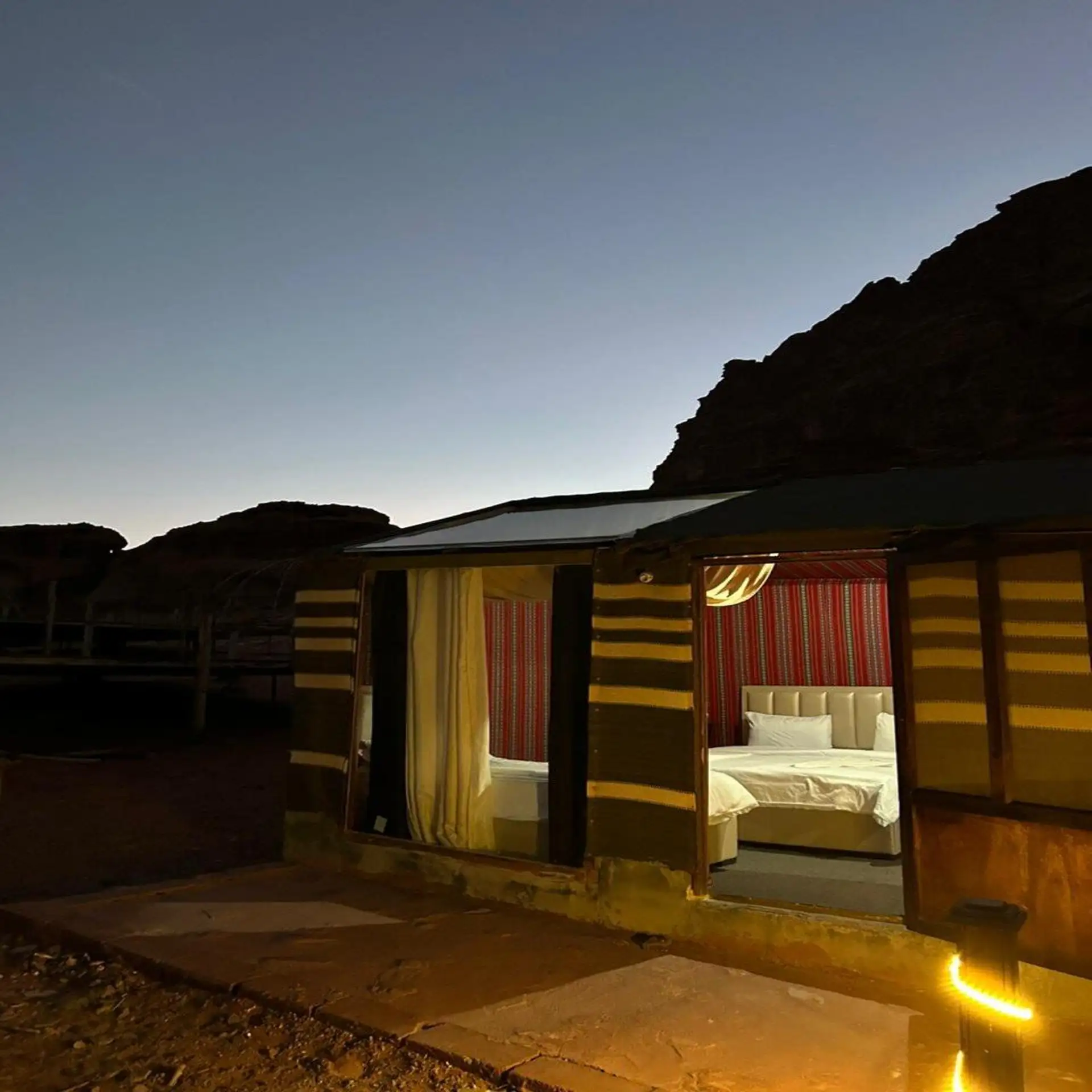 Bedouin camp in Wadi Rum desert under starry night sky Jordan